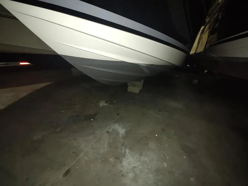 Slide: The Image of 2023 Sea Ray 320 Sundancer boat hull in storage. - 7