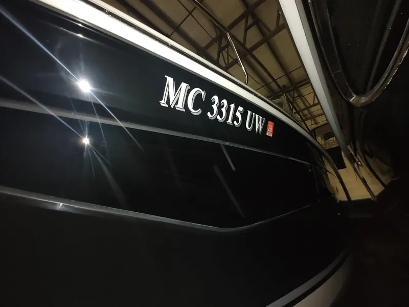 Slide: The Image of 2023 Sea Ray 320 Sundancer boat with registration number MC 3315 UW. - 8