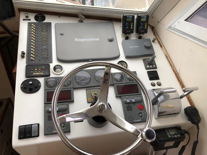 Slide: The Image of Control panel of a 2005 Morgan 31 boat with Raymarine navigation system. - 11