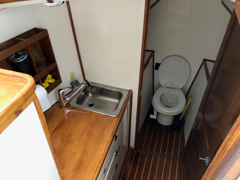Slide: The Image of 2005 Morgan 31 boat interior with sink and toilet - 14