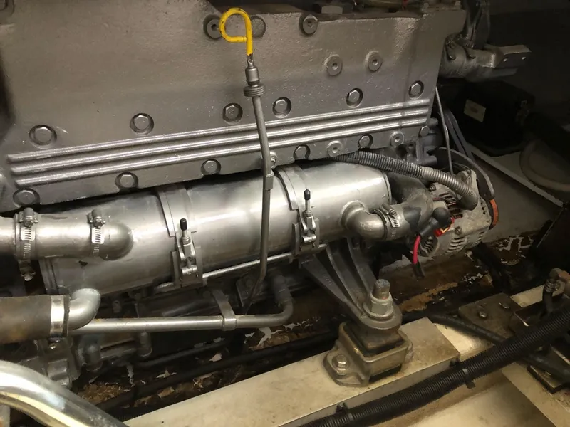 Slide: The Image of 2005 Morgan 31 engine close-up, showcasing mechanical components and wiring. - 21