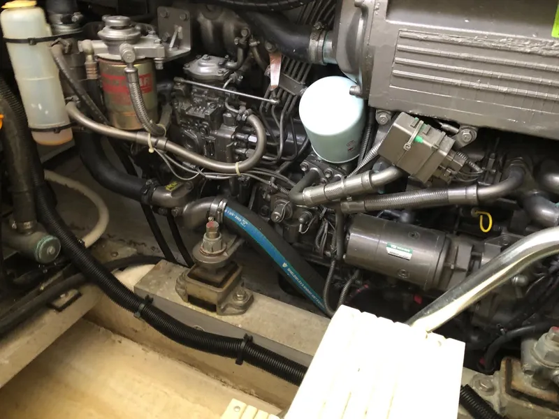 Slide: The Image of Close-up of a 2005 Morgan 31 engine compartment with various mechanical components. - 22