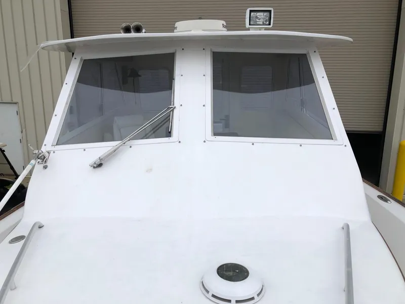 Slide: The Image of 2005 Morgan 31 boat front view with windshield and wiper. - 8