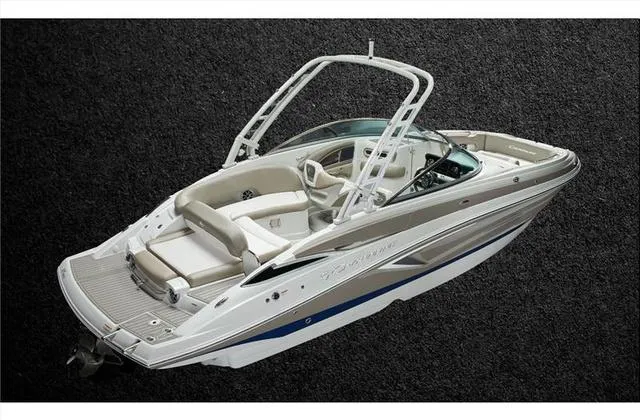 Slide: The Image of 2024 Crownline E255 boat with sleek design and spacious seating. - 19