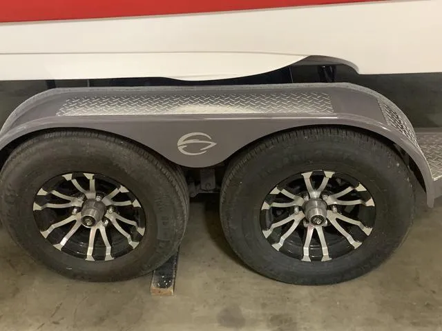 Slide: The Image of 2024 Crownline E255 boat trailer with dual wheels and custom fenders. - 3