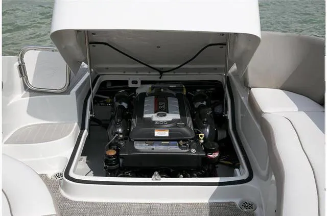 Slide: The Image of 2024 Crownline E255 boat engine compartment with open hatch. - 33