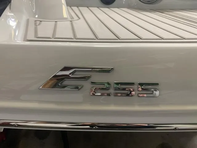 Slide: The Image of 2024 Crownline E255 boat rear deck with model emblem. - 6