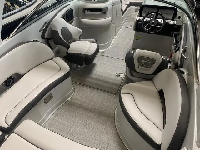 Slide: The Image of 2024 Crownline E255 boat interior with luxurious seating and modern helm. - 8
