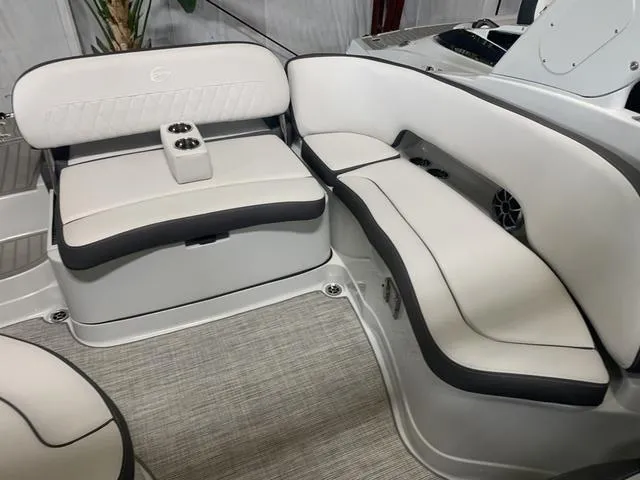 Slide: The Image of 2024 Crownline E255 boat interior with white and gray seating. - 9