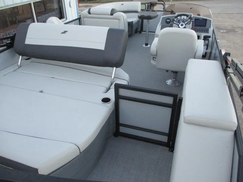 Slide: The Image of 2024 Starcraft EXS 1 Q DH pontoon boat interior with seating and helm. - 11