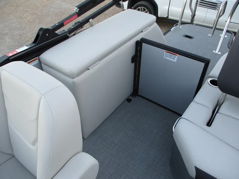 Slide: The Image of 2024 Starcraft EXS 1 Q DH boat interior seating and storage area. - 18