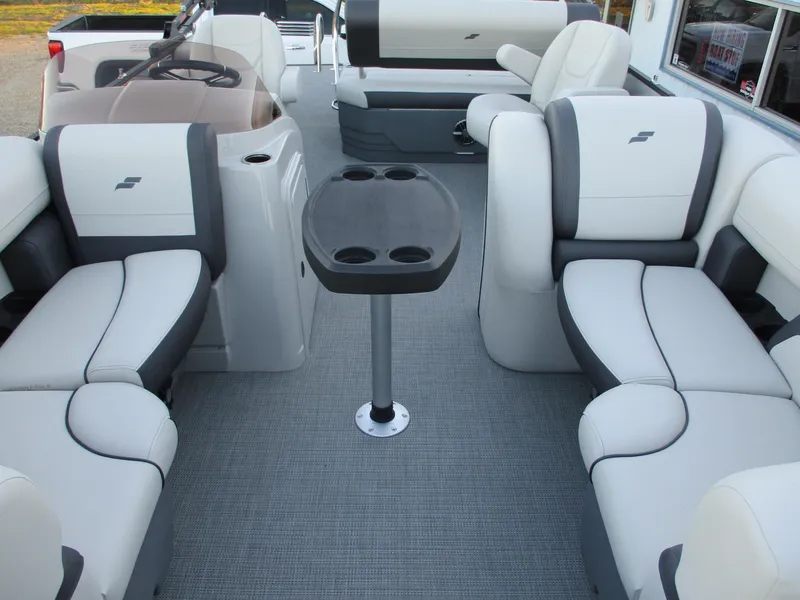Slide: The Image of 2024 Starcraft EXS 1 Q DH pontoon boat interior with seating and table. - 6