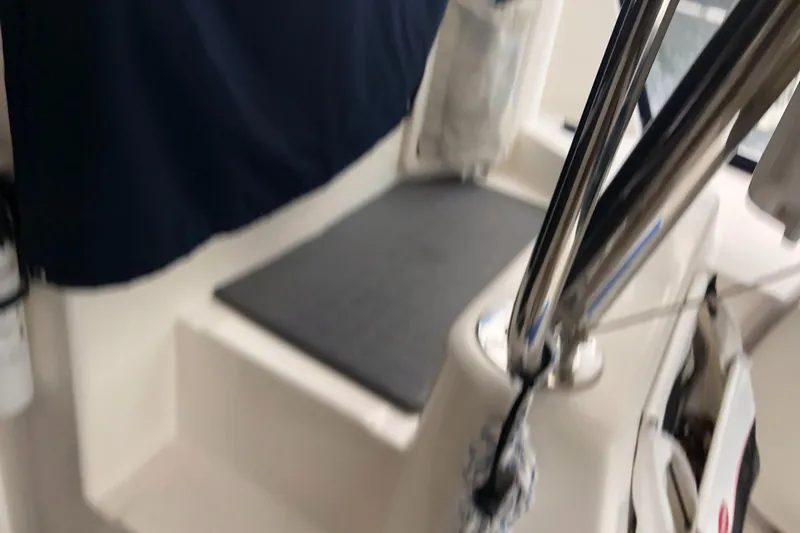 Slide: The Image of Interior view of a 2013 Leopard 39 Owner's Version yacht, featuring seating and stainless steel details. - 15