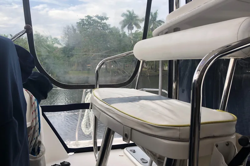 Slide: The Image of Interior view of 2013 Leopard 39 Owner's Version yacht with seating and window. - 16