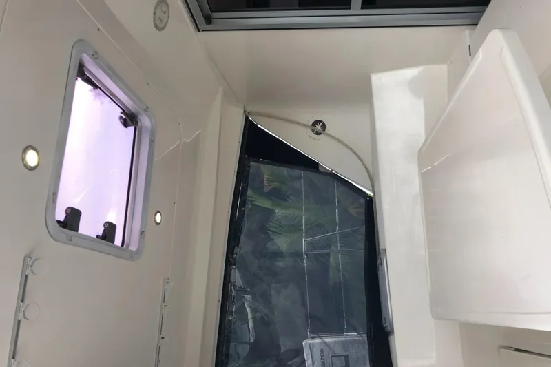 Slide: The Image of Interior view of 2013 Leopard 39 Owner's Version catamaran, featuring a window and sleek design. - 18