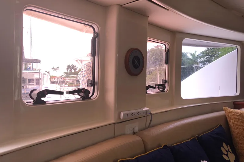 Slide: The Image of Interior view of 2013 Leopard 39 Owner's Version yacht with windows and seating area. - 22