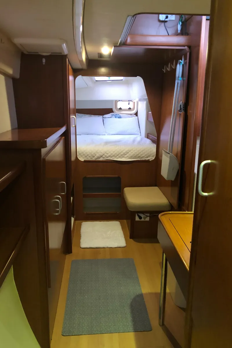 Slide: The Image of Interior of 2013 Leopard 39 Owner's Version yacht, featuring cozy cabin and wooden furnishings. - 24