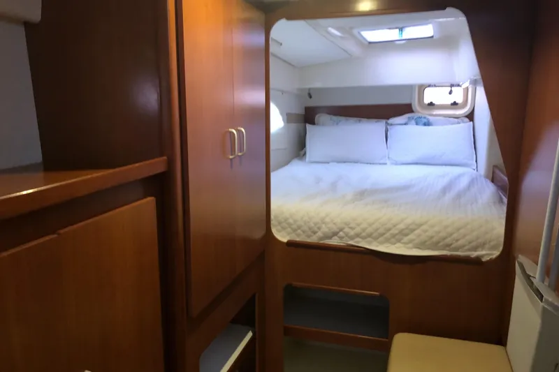 Slide: The Image of Cozy bedroom in 2013 Leopard 39 Owner's Version catamaran with wood cabinetry and skylight. - 26