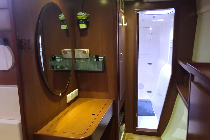 Slide: The Image of Interior of 2013 Leopard 39 Owner's Version yacht with wooden finish and mirror. - 27