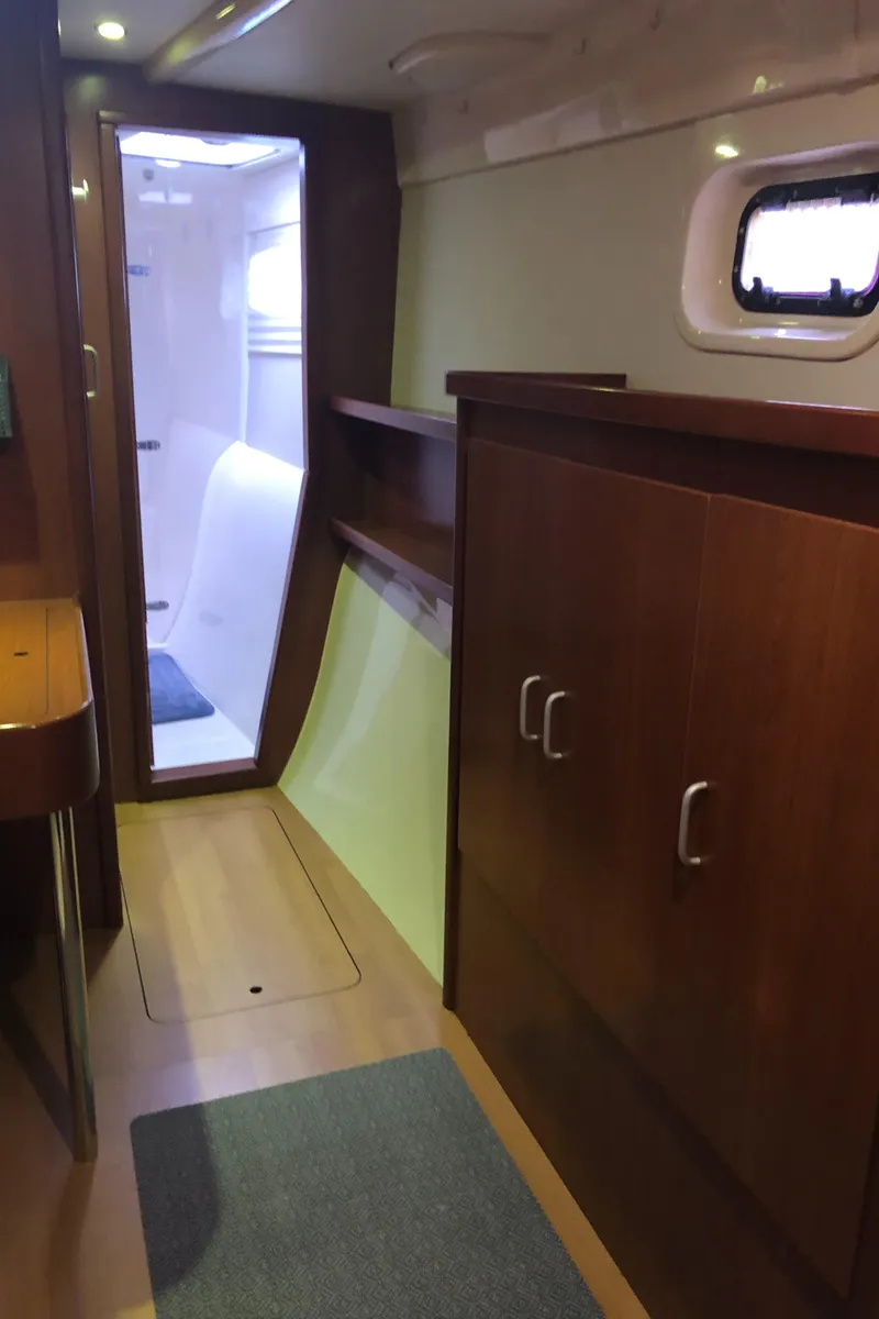 Slide: The Image of Interior of 2013 Leopard 39 Owner's Version yacht, featuring wood cabinetry and modern design. - 28