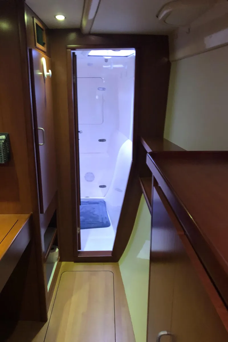 Slide: The Image of Interior of 2013 Leopard 39 Owner's Version yacht, featuring sleek wood finishes and modern design. - 29