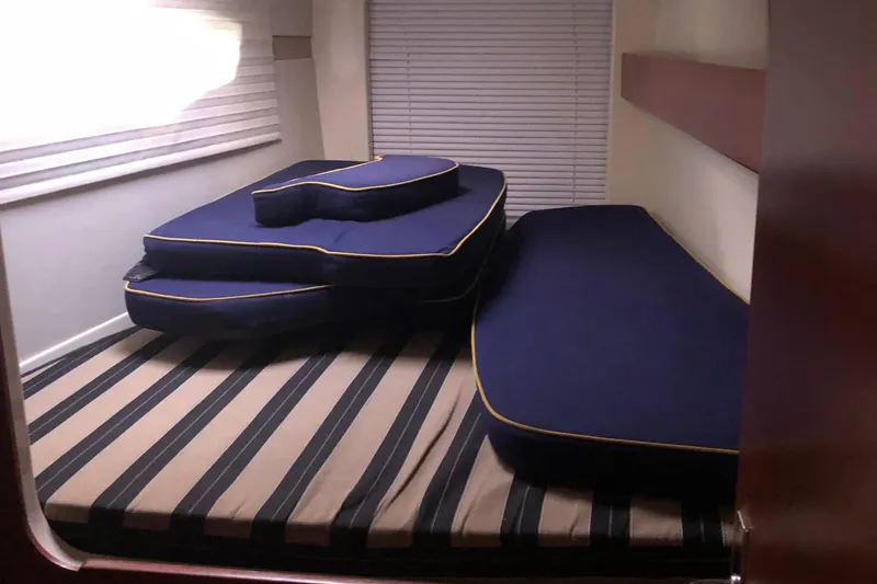 Slide: The Image of Interior cabin of 2013 Leopard 39 Owner's Version with blue cushions. - 33