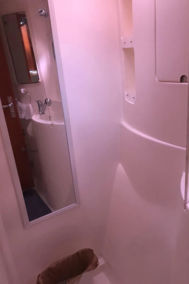 Slide: The Image of Bathroom interior of 2013 Leopard 39 Owner's Version yacht, featuring mirror and sink. - 34