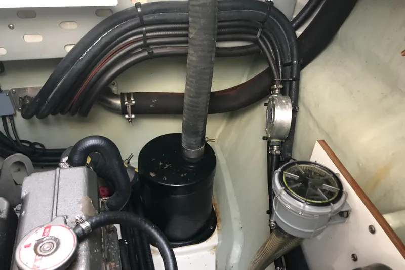 Slide: The Image of Engine compartment of a 2013 Leopard 39 Owner's Version yacht, showing hoses and components. - 45