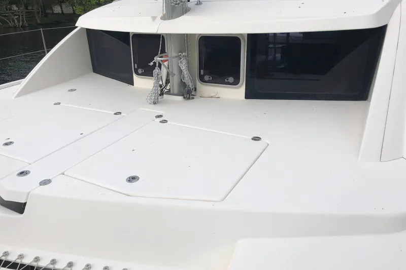 Slide: The Image of 2013 Leopard 39 Owner's Version catamaran deck with hatches and windows. - 6