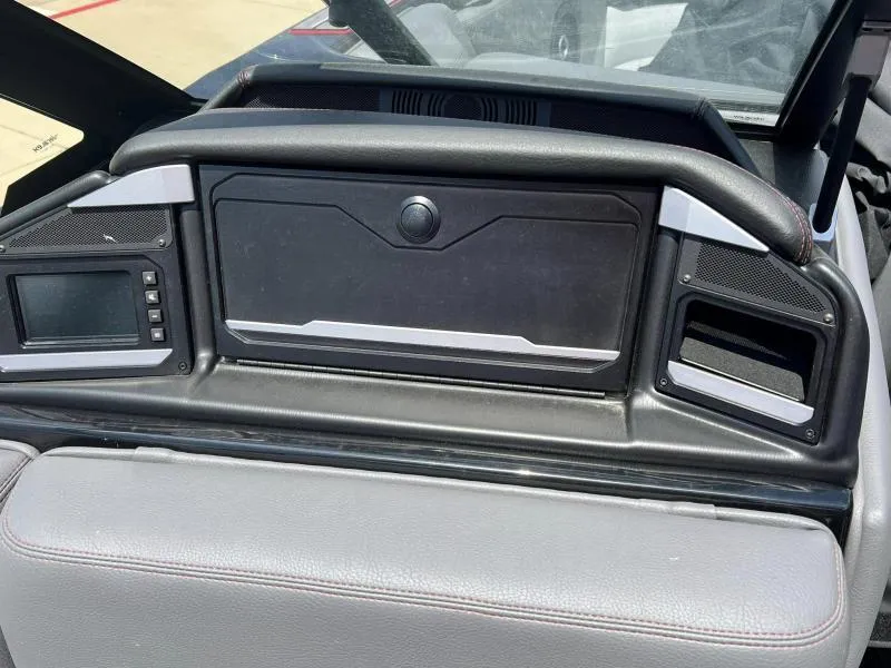 Slide: The Image of 2024 Supra SA 400 dashboard with control panel and storage compartment. - 10