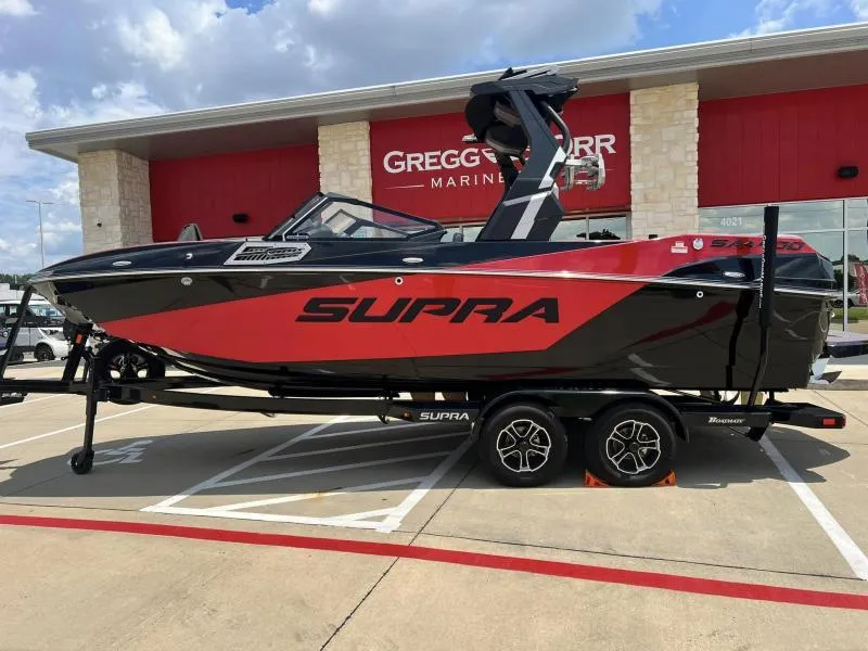 Slide: The Image of 2024 Supra SA 400 boat in red and black at Gregg Orr Marine dealership. - 3