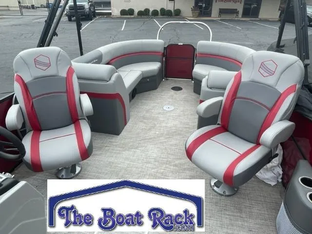 Slide: The Image of 2023 South Bay 224 RS 3.0 pontoon boat interior with gray and red seating. - 3