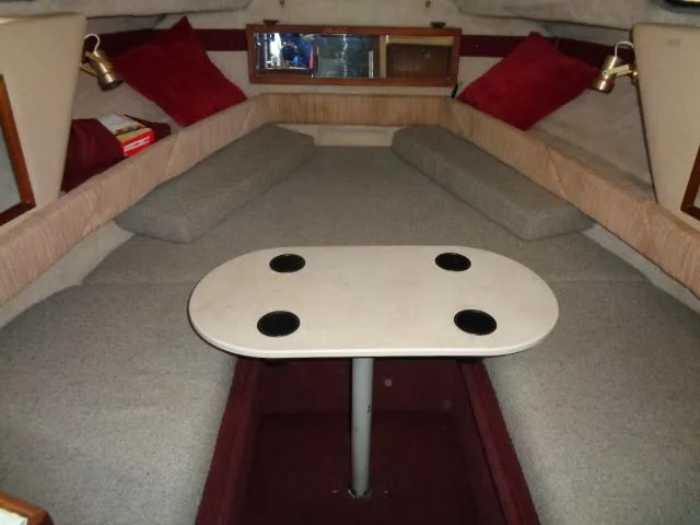 Slide: The Image of Interior cabin of 1986 Sea Ray 250 Sundancer with table and seating. - 2