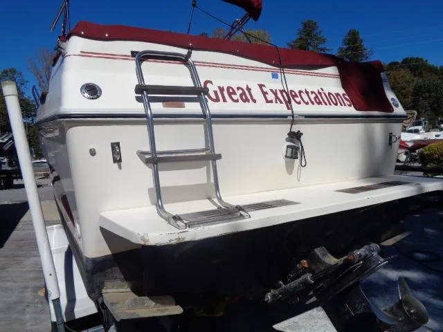 Slide: The Image of 1986 Sea Ray 250 Sundancer boat named Great Expectations with swim ladder and stern view. - 26