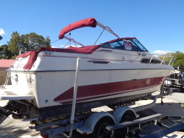 Slide: The Image of 1986 Sea Ray 250 Sundancer boat on trailer with red canopy for sale. - 27