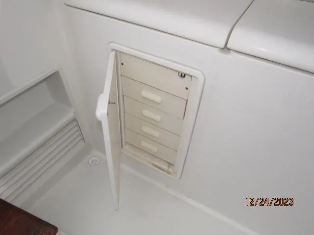 Slide: The Image of Storage compartment on a 2001 Ocean Yachts Super Sport boat. - 16