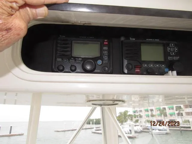 Slide: The Image of 2001 Ocean Yachts Super Sport radio equipment and control panel. - 17