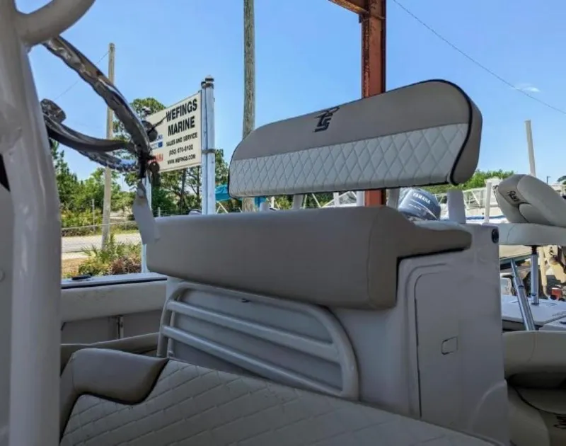 Slide: The Image of 2022 Carolina Skiff 24 Ultra Elite boat interior with cushioned seating at Wefings Marine. - 10