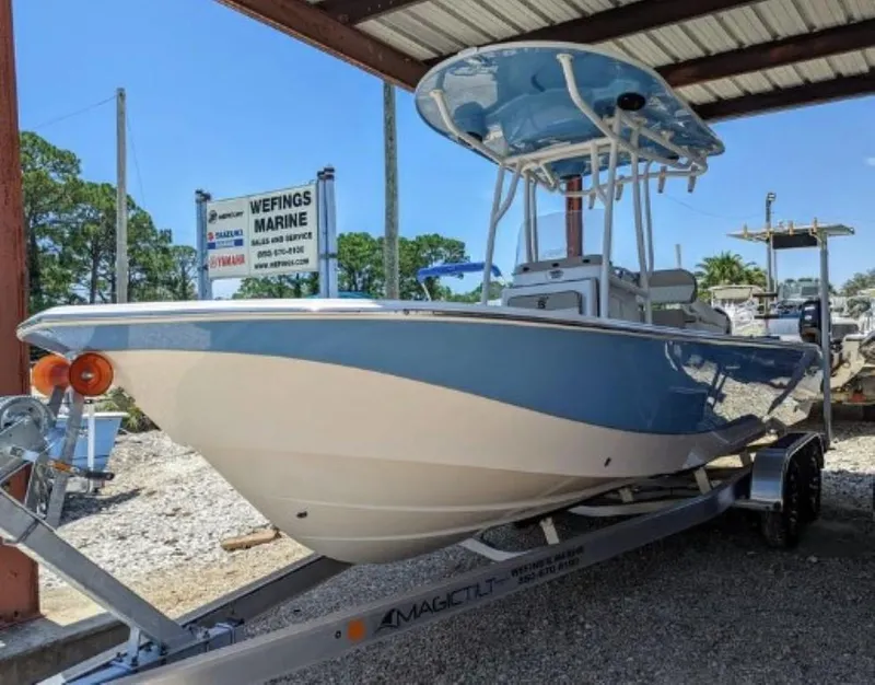 Slide: The Image of 2022 Carolina Skiff 24 Ultra Elite boat on a trailer at Wefings Marine. - 2