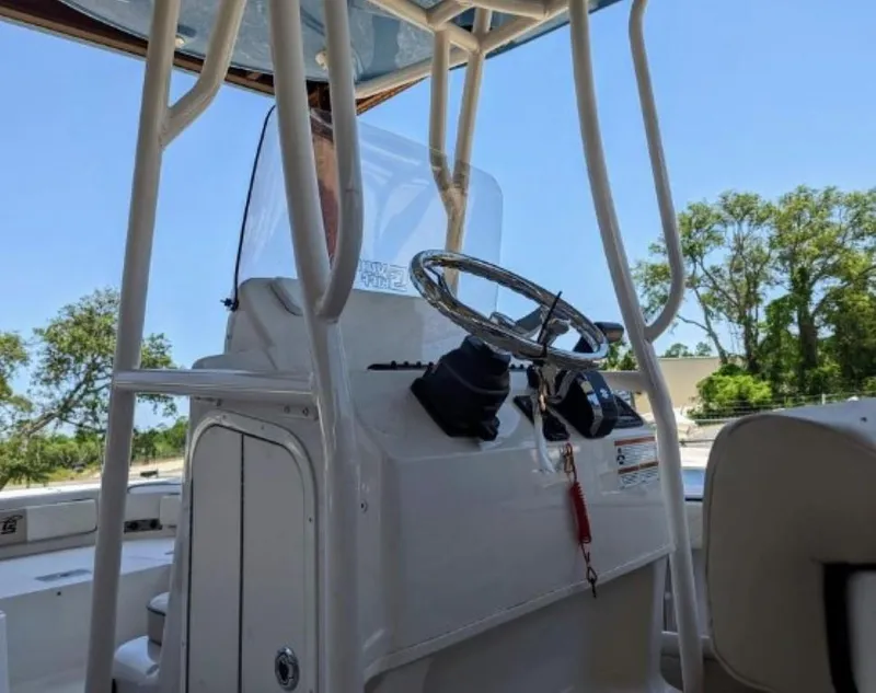 Slide: The Image of 2022 Carolina Skiff 24 Ultra Elite boat console and steering wheel. - 4