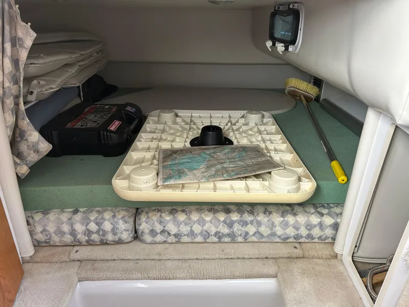 Slide: The Image of Interior cabin of 2000 Four Winns 268 Vista boat with storage and equipment. - 11