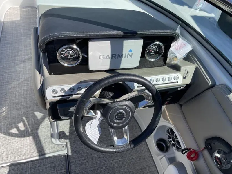 Slide: The Image of 2023 Crownline Eclipse E 235 boat dashboard with Garmin navigation system. - 10