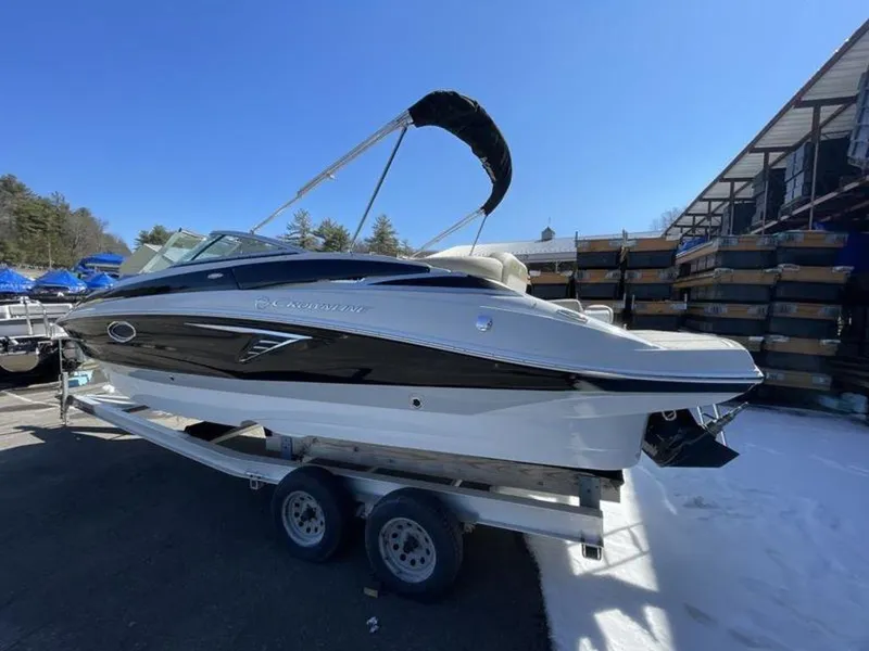 Slide: The Image of 2023 Crownline Eclipse E 235 boat on a trailer in a marina. - 3