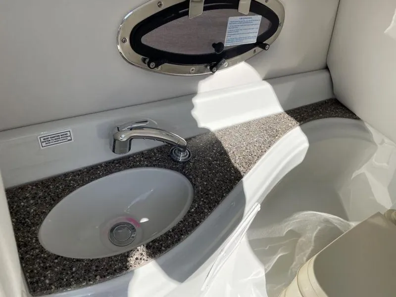 Slide: The Image of 2023 Crownline Eclipse E 235 boat bathroom sink and countertop. - 5