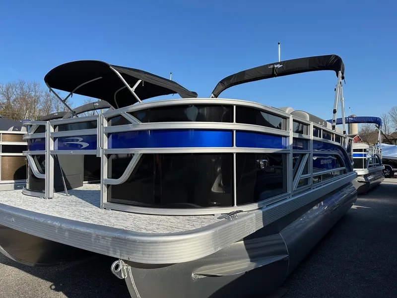 The Image of 2025 Bennington 188 SF pontoon boat with blue accents and canopy, in stock. - 1
