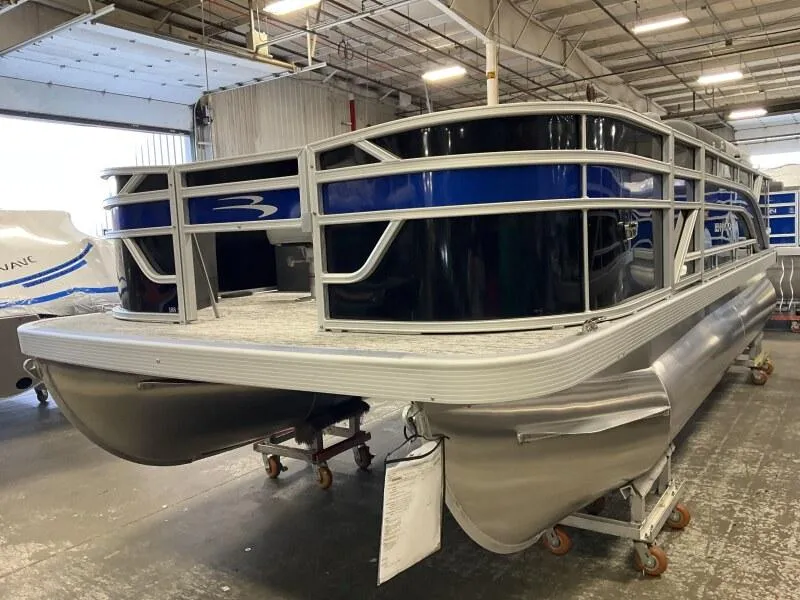 Slide: The Image of 2025 Bennington 188 SF pontoon boat in warehouse, featuring sleek design and durable construction. - 10