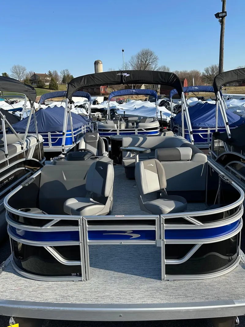 Slide: The Image of 2025 Bennington 188 SF pontoon boat with four fish seats, in stock, outdoor display. - 14