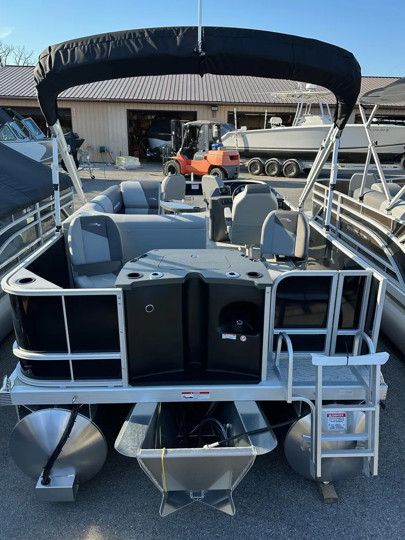 Slide: The Image of 2025 Bennington 188 SF pontoon boat with four fishing seats, docked outdoors. - 17