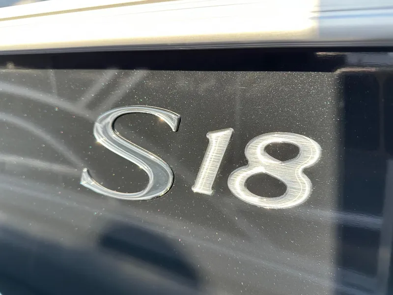 Slide: The Image of Close-up of 'S18' emblem on 2025 Bennington 188 SF Family boat. - 19