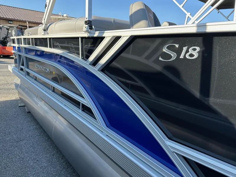 Slide: The Image of 2025 Bennington 188 SF pontoon boat with sleek blue and black design. - 20